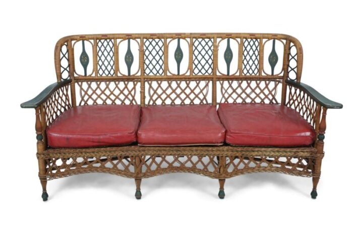 3 seat american art deco style wicker sofa with painted floral embellishments on the seat backs and 0410