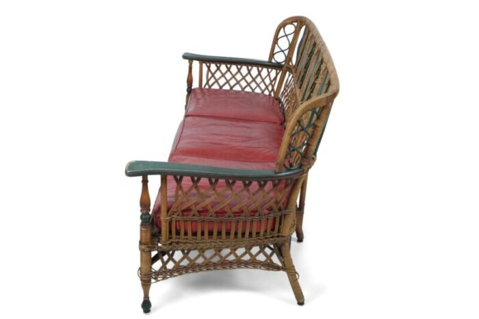 3 seat american art deco style wicker sofa with painted floral embellishments on the seat backs and 7908