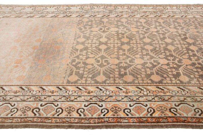 antique khotan wool rug handmade in peach color with geometric pattern 9082