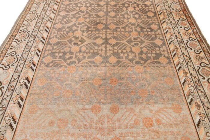 antique khotan wool rug handmade in peach color with geometric pattern 9773