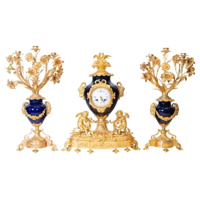 french gilt bronze and sevres porcelain clock set 19th century set of 3 1