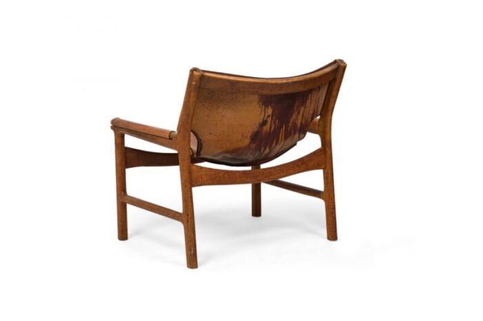 illum wikkels danish mid century caramel leather and oak sling design lounge chair 0678