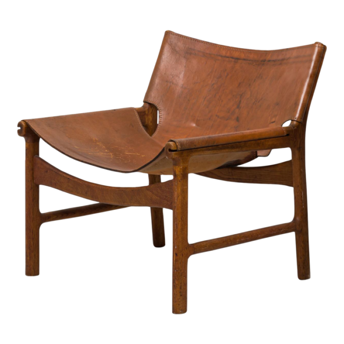 illum wikkels danish mid century caramel leather and oak sling design lounge chair 5443