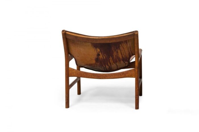 illum wikkels danish mid century caramel leather and oak sling design lounge chair 5498