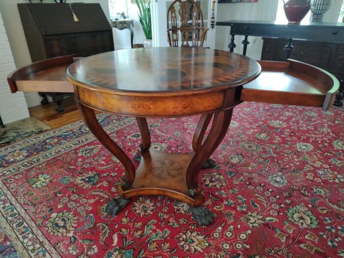 swirling teardrops centre circular table with two pull out drawers theodore alexander the original regency 5011