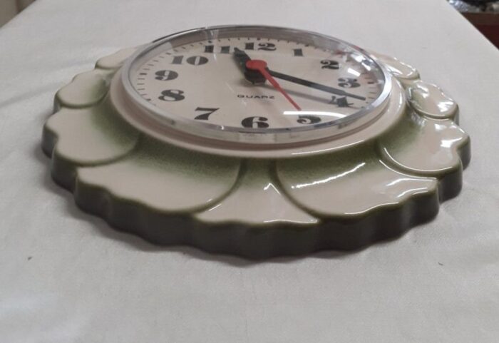 vintage german wall clock with a white and green ceramic housing in the shape of a leaf 1970s 3