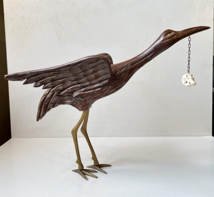 wooden crane bird with suspended skull 1940s 2